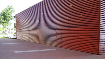 Logistical and industrial up and over doors, lined with veneer and wooden cladding